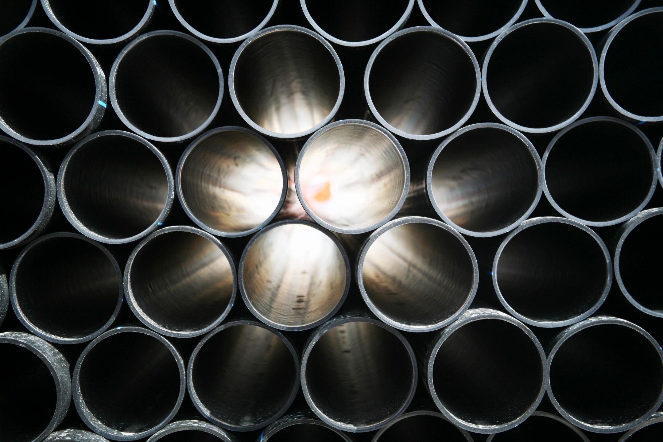 Stacked industrial metal pipes